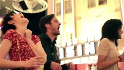 young woman laughs as friends rock out to live music in downtown Las Vegas Stock Footage