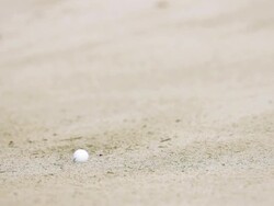 Slow motion golf hit out of a sand trap Stock Footage