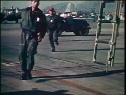 1960s pilots running + climbing ladder onto airplane during emergency / Cold War / documentary Stock Footage