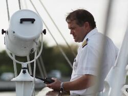 ship captain on a walkie talkie Stock Footage
