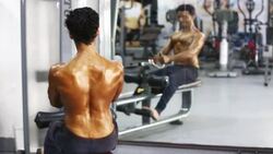 Body Builder Performing Middle Back Exercise in the Gym Stock Footage