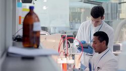 Scientists using digital tablet for experiment in laboratory Stock Footage