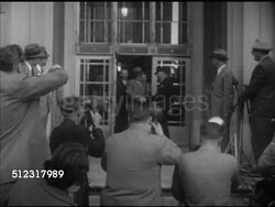 1952: CORRUPTION:  VS Rhode Island Attorney J. Howard McGrath (James McGrath, 1903-1966) walking out of building entrance w/ others for press, speaking at microphone (no SOT). Press conference, interview Instructional Video