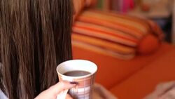 Girl in bed with coffee cup Stock Footage