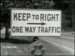 1949: U.S. TRAFFIC SIGNS: VS Road signs 'Keep to Right One Way Traffic, Curve, Slow Dangerous Intersection, Caution Cross Road, Full Stop No Left Turn.' Instructional Video