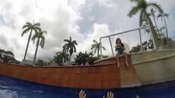 Crazy father speaks to camera then kids play pool basketball and father throws ball into net. Stock Footage