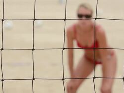  CU R/F Women playing beach volleyball through net / Redondo Beach, California, United States Stock Footage