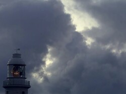 CU Light circling in lighthouse against dark sky  / Margaret River, Western Australia, Australia Stock Footage