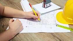 young architect working on blueprints Stock Footage