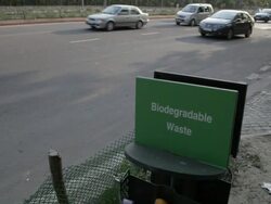 WS Trash bin for Biodegradable waste on side of busy road / New Delhi, India Stock Footage