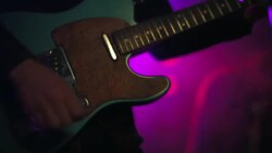 Close up guitar player strumming low angle Stock Footage