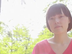 CU Shot of young woman in park / Nakano, Tokyo, Japan Stock Footage