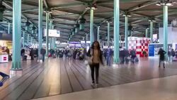 HD time-lapse zoom out: Traveler Airport station Terminal Schiphol Amsterdam Netherlands Stock Footage