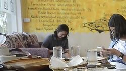 Three Asia people texting, sending sms on smartphone in cafe Stock Footage