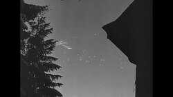US soldiers watch planes fly overhead in Belgium during World War II News Clip