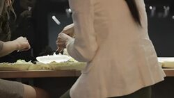 Rear view of businesswoman eating take out food at work Stock Footage