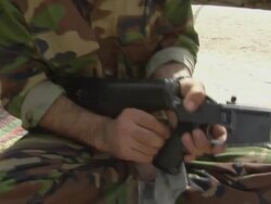 CU PAN TU TD Afghan soldier cleaning machine gun / Musa Qala, Helmand Province, Afghanistan. Stock Footage