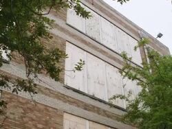 MS TU Boarded up windows at abandoned elementary school Stock Footage