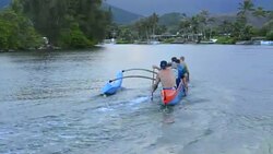 Kailua Hawaii Oahu canoe club rowing on Outrigger Canoes in bay practice sports athletics exercise Stock Footage