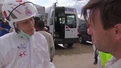 Rescue Worker Soundbite - Rescued Migrants arrive in Sicily, Italy News Clip