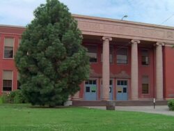 WS PAN ZI View of red brick Ulysses S. Grant High School with columns at entrance / Portland, Oregon, United States Stock Footage