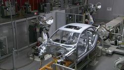 Robots operate in an automotive factory. Stock Footage