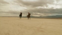 Riding Horses in the Dessert 01 Stock Footage
