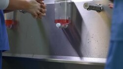 medical team scrubbing up Stock Footage