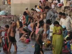 MS Large group of people bathing in Gangas river / Varanasi, Uttar Pradesh, India Stock Footage