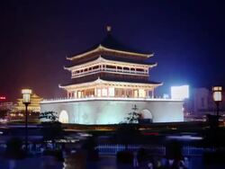 Ancient Chinese tower surrounded by traffic Stock Footage