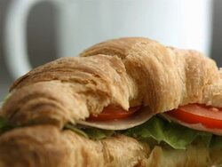 HD: Cup Of Coffee And Croissant Sandwich Stock Footage
