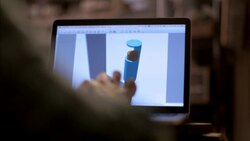 Man uses design program on laptop computer in wood studio Stock Footage