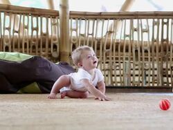 MS Shot of baby trying to crawl / Ubud, Bali, Indonesia Stock Footage