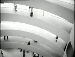 Patrons enjoy the paintings in the Guggenheim Museum in New York City. News Clip