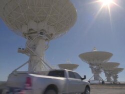  WS View of truck pulling solar panel through Very Large Array / San Augustine, New Mexico, USA Stock Footage