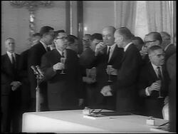 B/W 1963 politicians drinking champagne after the signing of the Atomic Test Ban Treaty / newsreel Stock Footage
