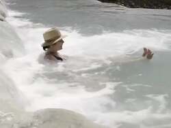 WS View of Woman relaxing in hot spring, thermal pools of sulphurous water / Saturnia, Tuscany, Italy Stock Footage