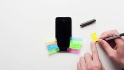 Timelapse of a businessman putting post it notes onto a mobile phone Stock Footage