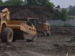 Caterpillar machinery working at a construction site Stock Footage