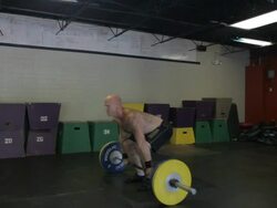 Medium wide 3/4 profile. Dustin performs clean and jerk. Stock Footage