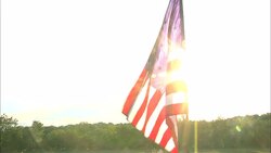 Sunlight shines through a waving Union flag during the Civil War. Stock Footage