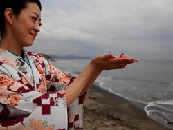 Japanese woman holding red origami Stock Footage