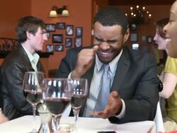 Young Adults Laugh at Busy Restaurant Stock Footage