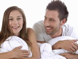 HD: Young Couple Video Chatting On Bed Stock Footage