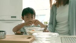 Mother and son baking together Stock Footage
