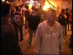 Fatah supporters protesting in street, start fire News Clip