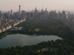 Aerial flying over Central Park looking south at park and midtown Manhattan Stock Footage