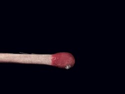 Igniting and Burning Match against Black background, Slow motion Stock Footage