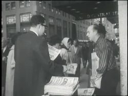 Commuters in Grand Central Station buy newspapers to read about the Cuban Missile Crisis. News Clip