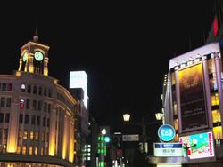 Lit Buildings at Ginza at Night with Ginza Line Subway Entrance, Tokyo, Japan Stock Footage